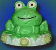 3-d frog cake sculpture with marchmallow eyes and fondant icing