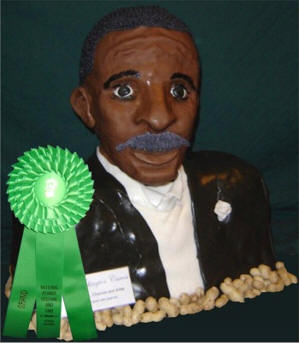 Bust of George Washington Carver carved out of cake and decorated with fondant icing